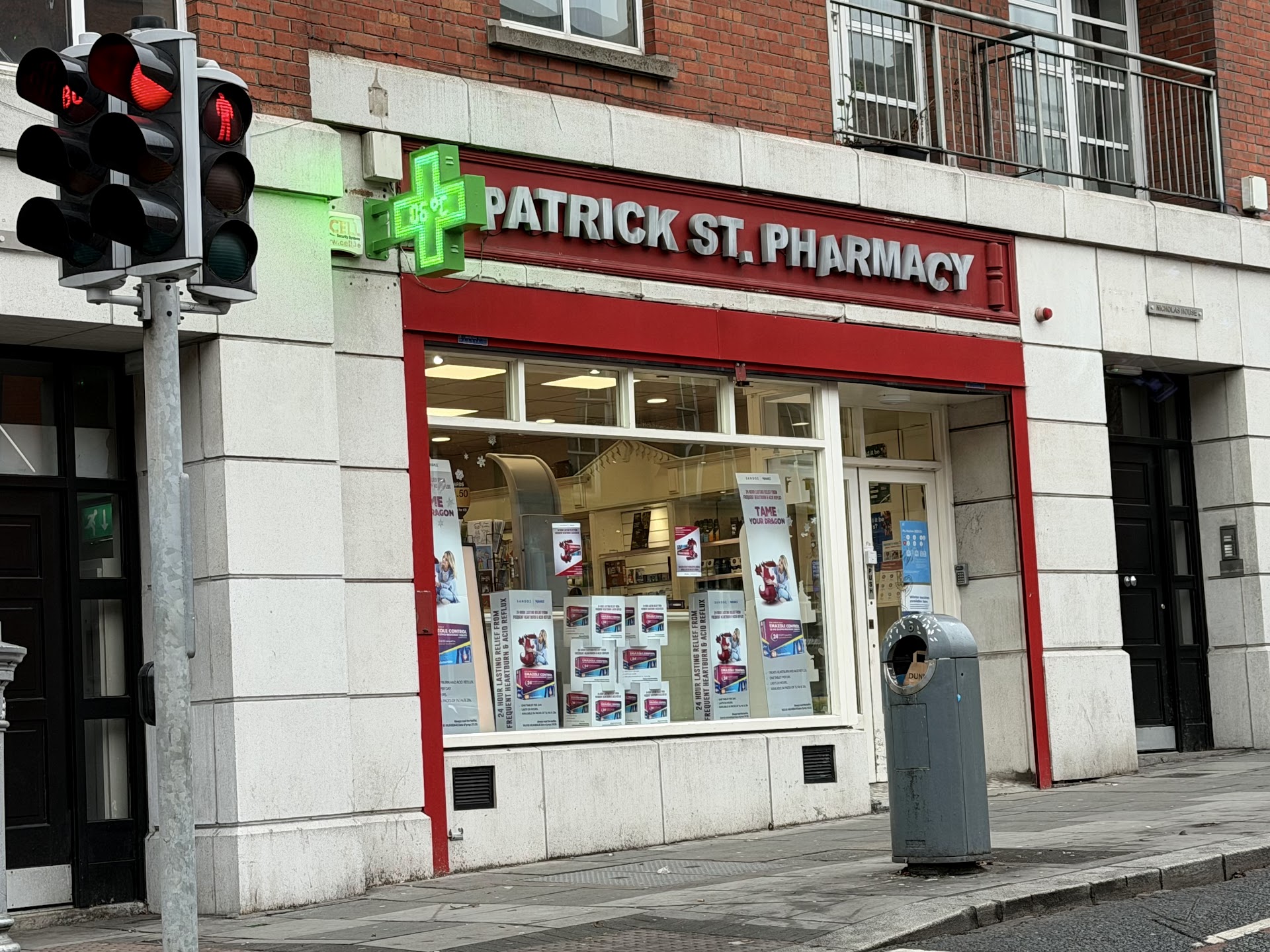Patrick Street Pharmacy — the red shopfront on Patrick Street